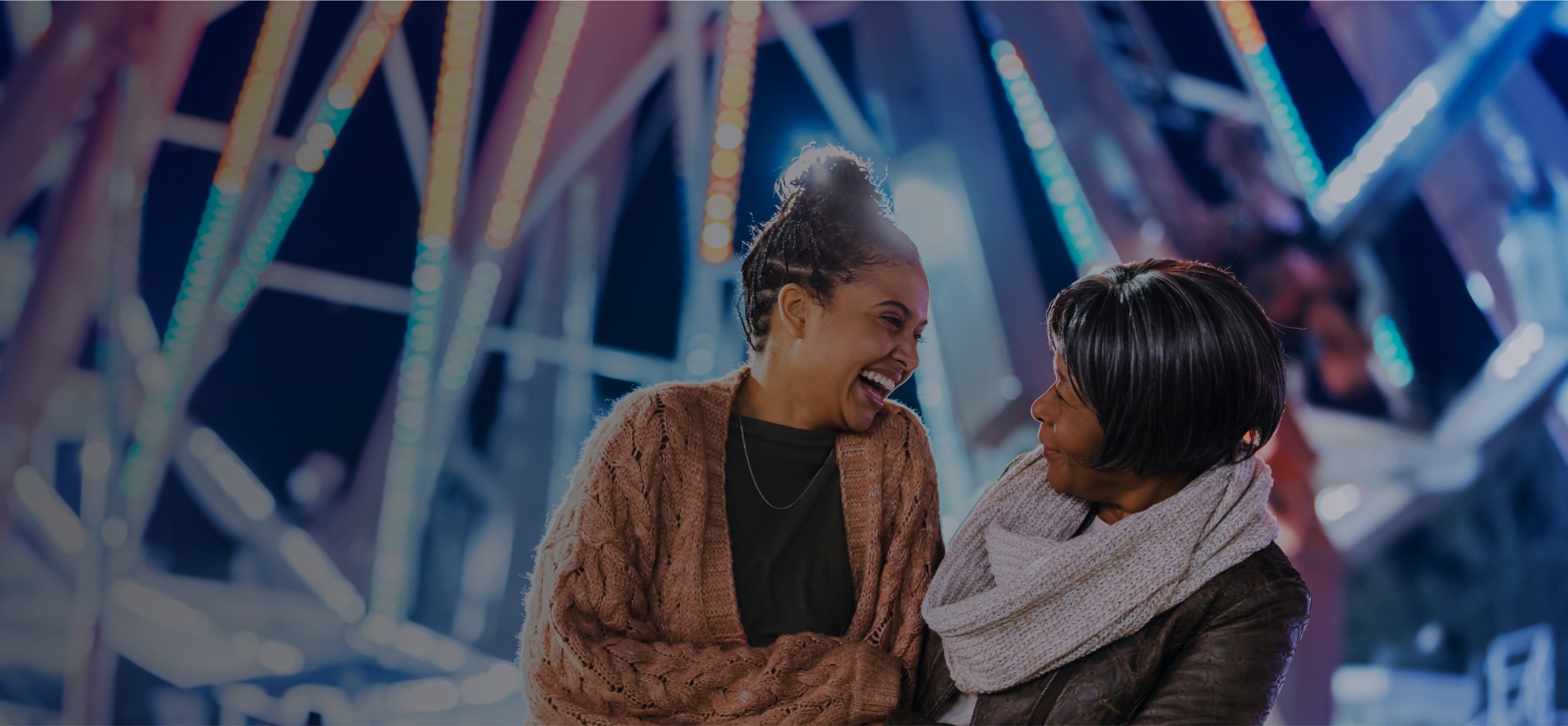 2 ladies laughing outside