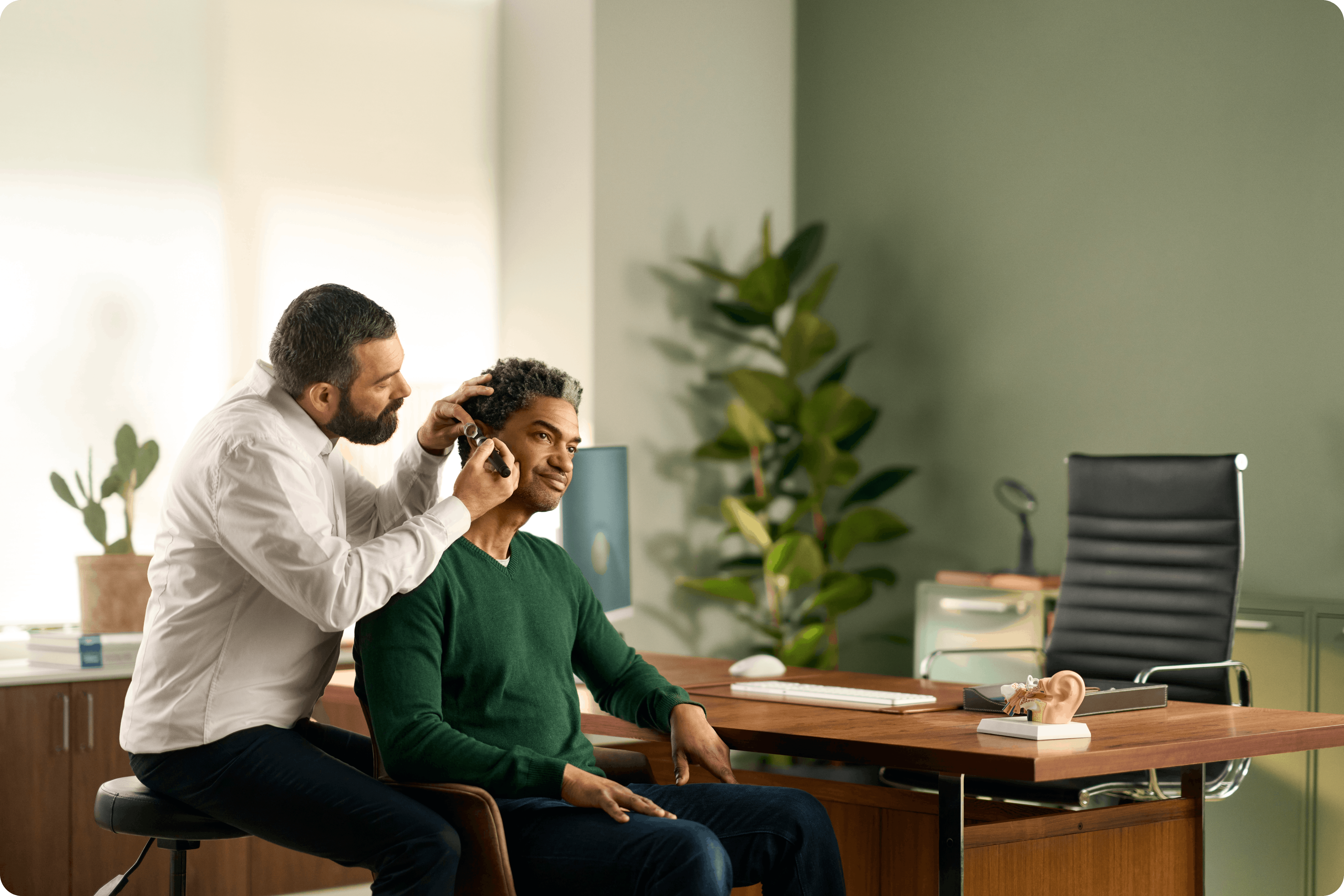 Audiologist with a patient
